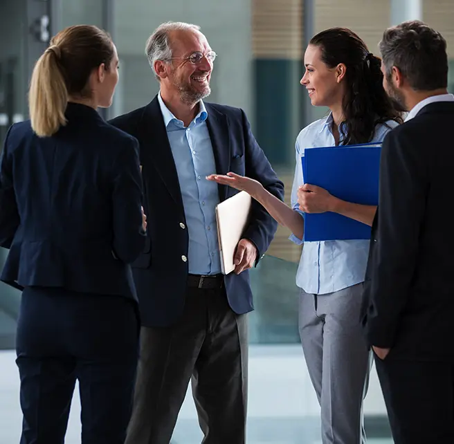 Mission | Group of executives talking to each other in a circle - Smart Health Benefits Association
