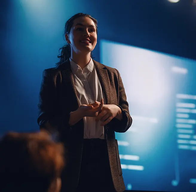 Advocacy | Woman presenting at a conference - Smart Health Benefits Association